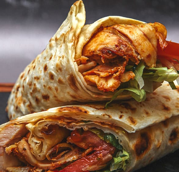Order a delicious chicken wrap from Burger and Dough